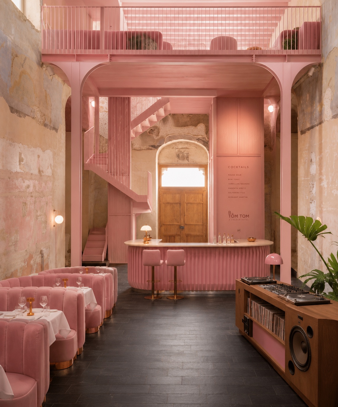 Bom Tom — restored interior, blue-grey structure amid pastel plaster